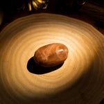 Golden Sun Stone Palm Stone - helmsman - crystal