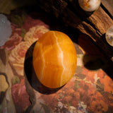 Yellow Calcite Palm Stone - helmsman - crystal